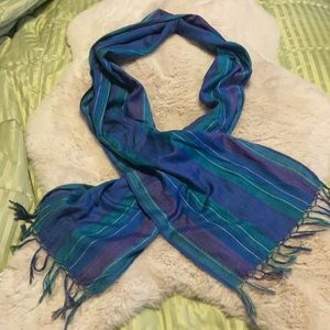 Multicolor striped scarf with fringed ends.